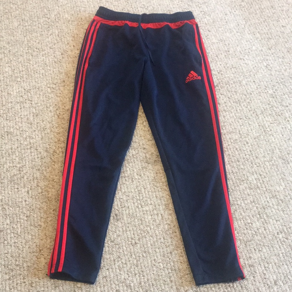 Blue and red Adidas track pants